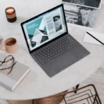 Home office desk with an external monitor connected to a laptop