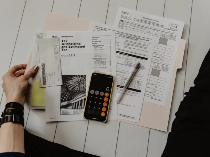 Freelancer creating an invoice on a laptop at a home desk