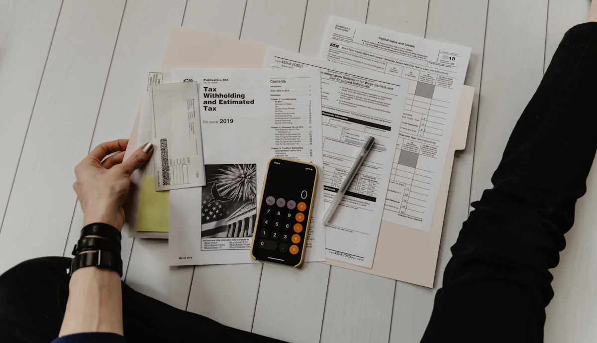 Freelancer creating an invoice on a laptop at a home desk