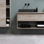 Home office setup with an adjustable standing desk and laptop