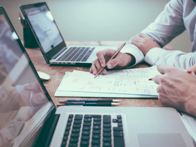 Marketer writing customer research notes to build buyer personas