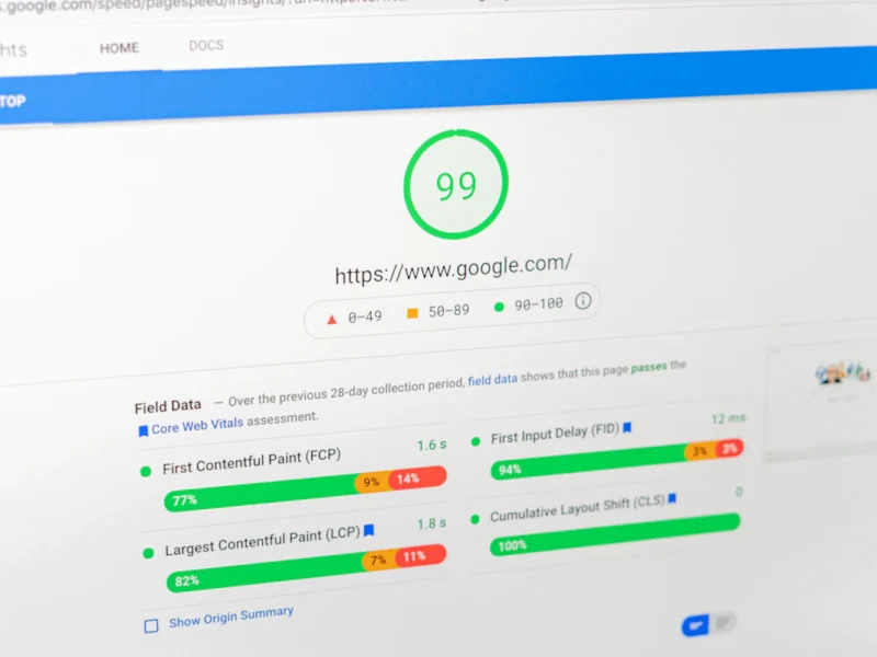 Laptop screen showing a website speed test score for a WordPress site