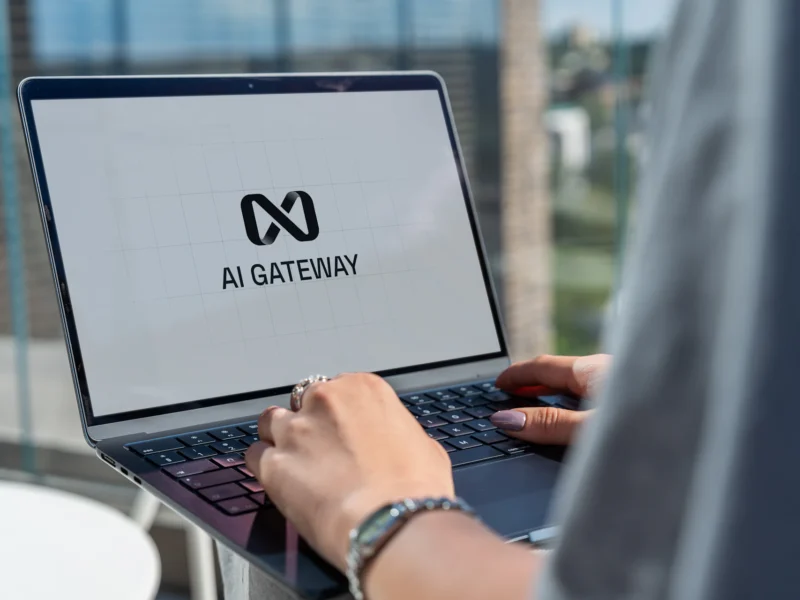 Marketer using ChatGPT on a laptop to plan a digital marketing campaign