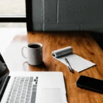 Marketer writing landing page copy on a laptop
