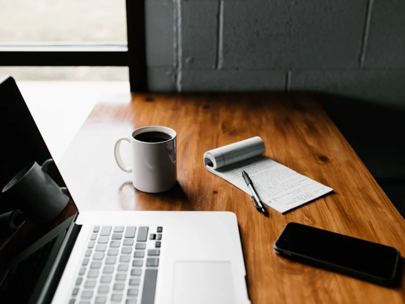 Marketer writing landing page copy on a laptop
