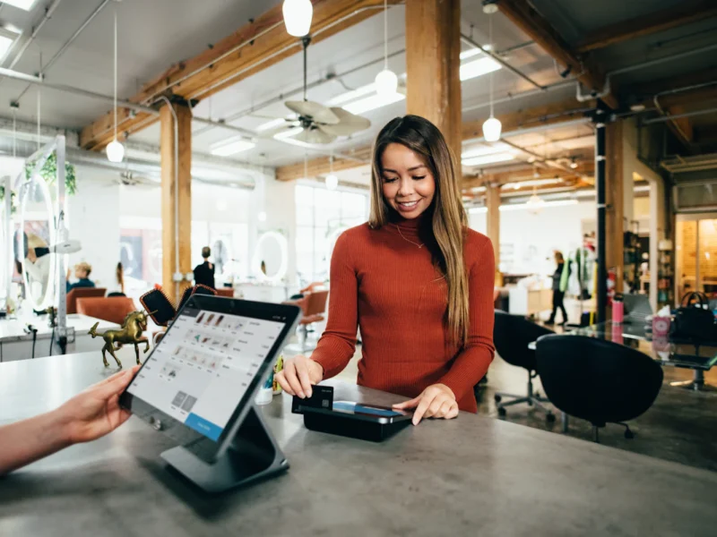 Small business owner checking local search results and Google Business Profile on a laptop